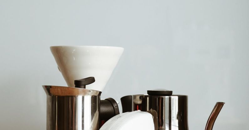 Fuel Filter - Stainless Steel Moka Pot and Kettle on the Table