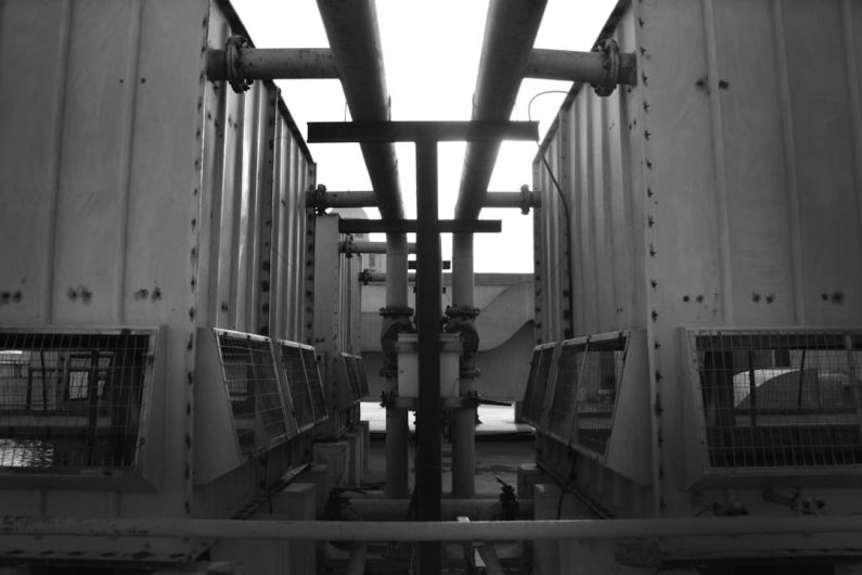 Fuel System - a black and white photo of a bunch of cages