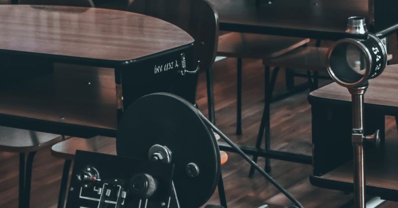 Alternator - From above of retro dynamo electrical generator with Faraday disc placed on wooden table in classroom
