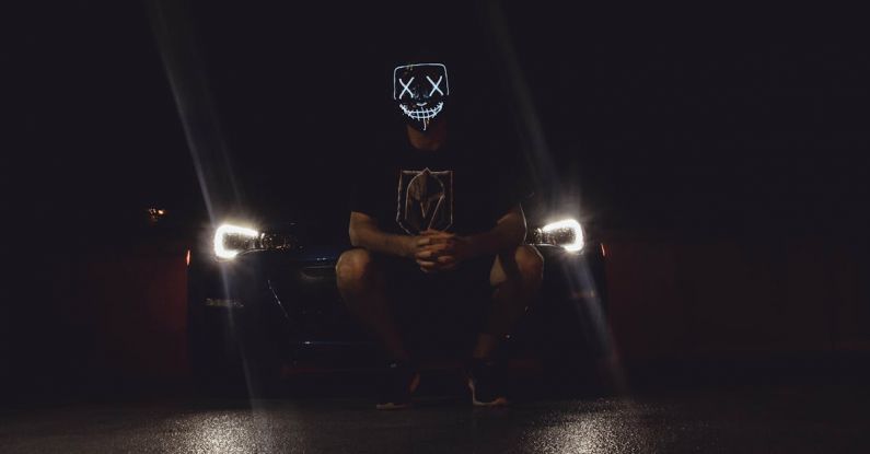 LED Headlights - Photo of Person Wearing Mask While in Front of Vehicle