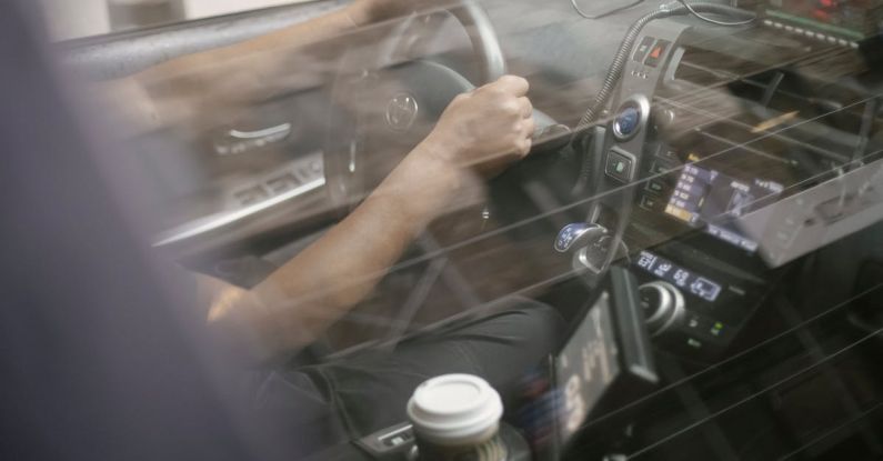 Stereo System - Man driving automobile with convenient dashboard
