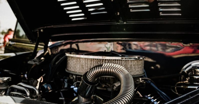 Catalytic Converter - A close up of the engine compartment of a car