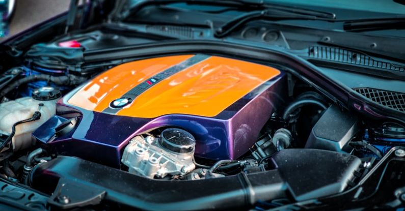 Turbocharged Engine - A purple and orange engine cover on a car