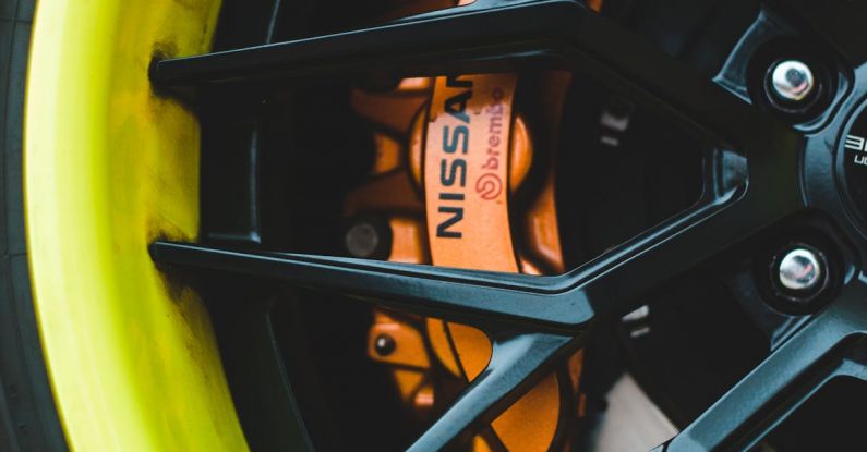 Tire Rotation - Closeup of modern alloy wheel of automobile with tire and metal brake disc